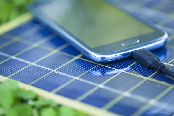 depositphotos 49036713 stock photo charging mobile phone with solar